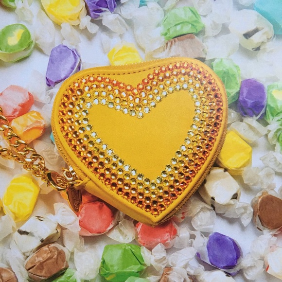 Tara Tarantino heart coin purse surrounded by candy
Art matted - Picture 3 of 3